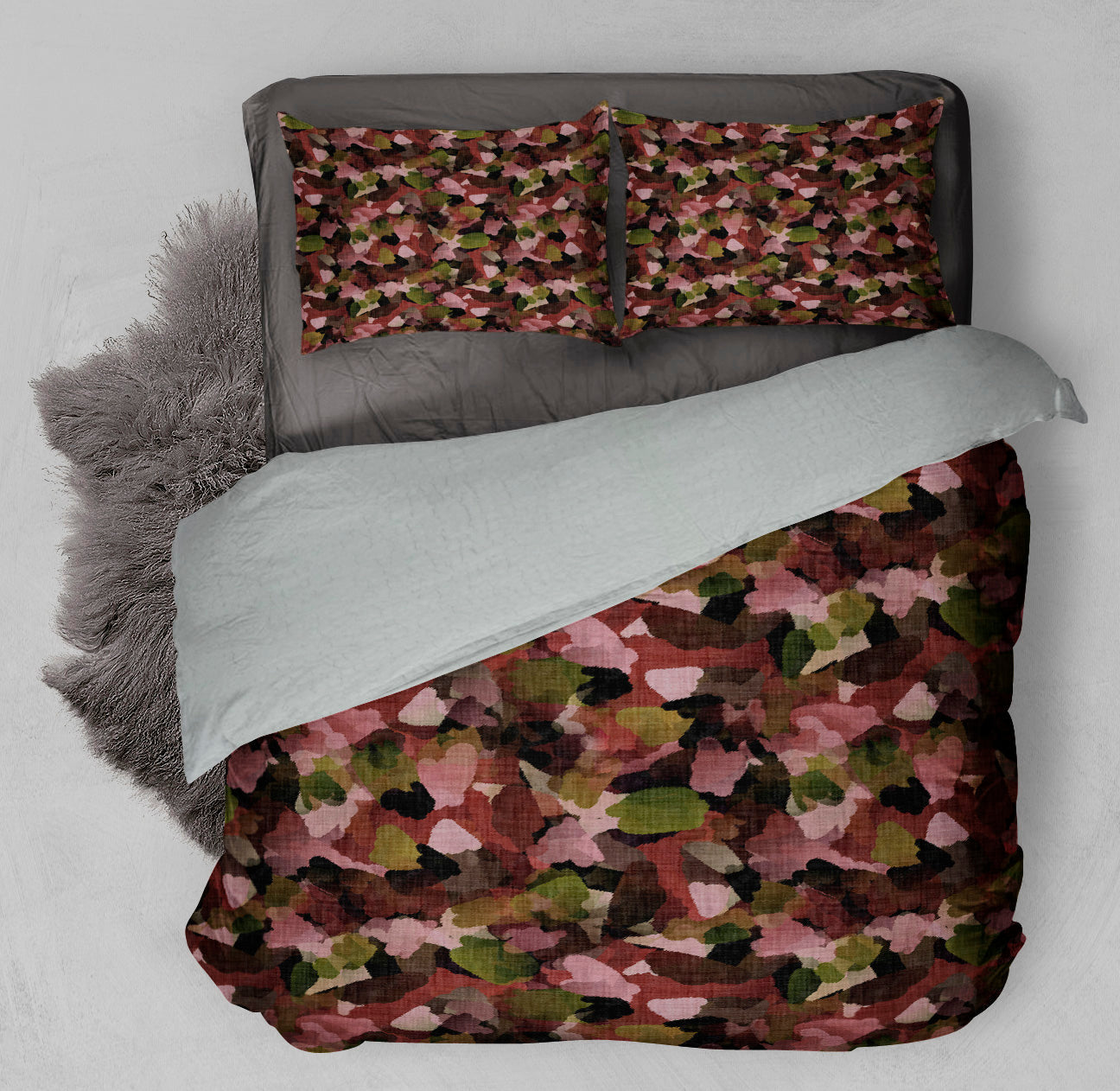 Bed with winter ready Sherpa comforter displaying printed comforter set adorned with refreshing autumn leaf motifs.