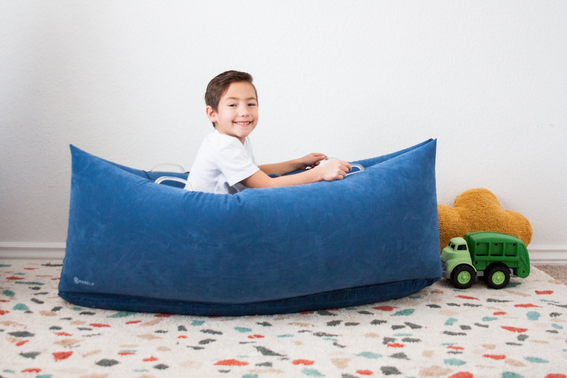 Young boy in playroom experiencing Harkla Hug.