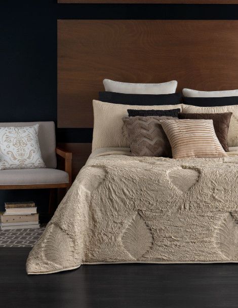 Traditional bedroom with tan, leaf embossed quilt for adults. Luxus Champagne Palm Quilt.