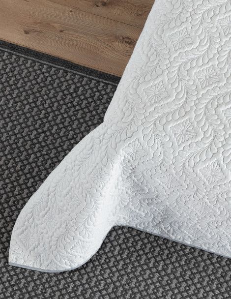 Close up detail of white Victoria 3D Quilt with quality damask design.