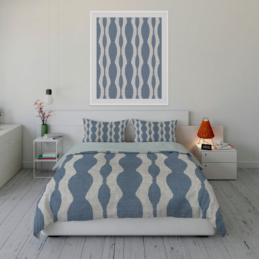Coastal style bedroom featuring flowing, chambray Sherpa comforter set adorned with gray wave motifs.