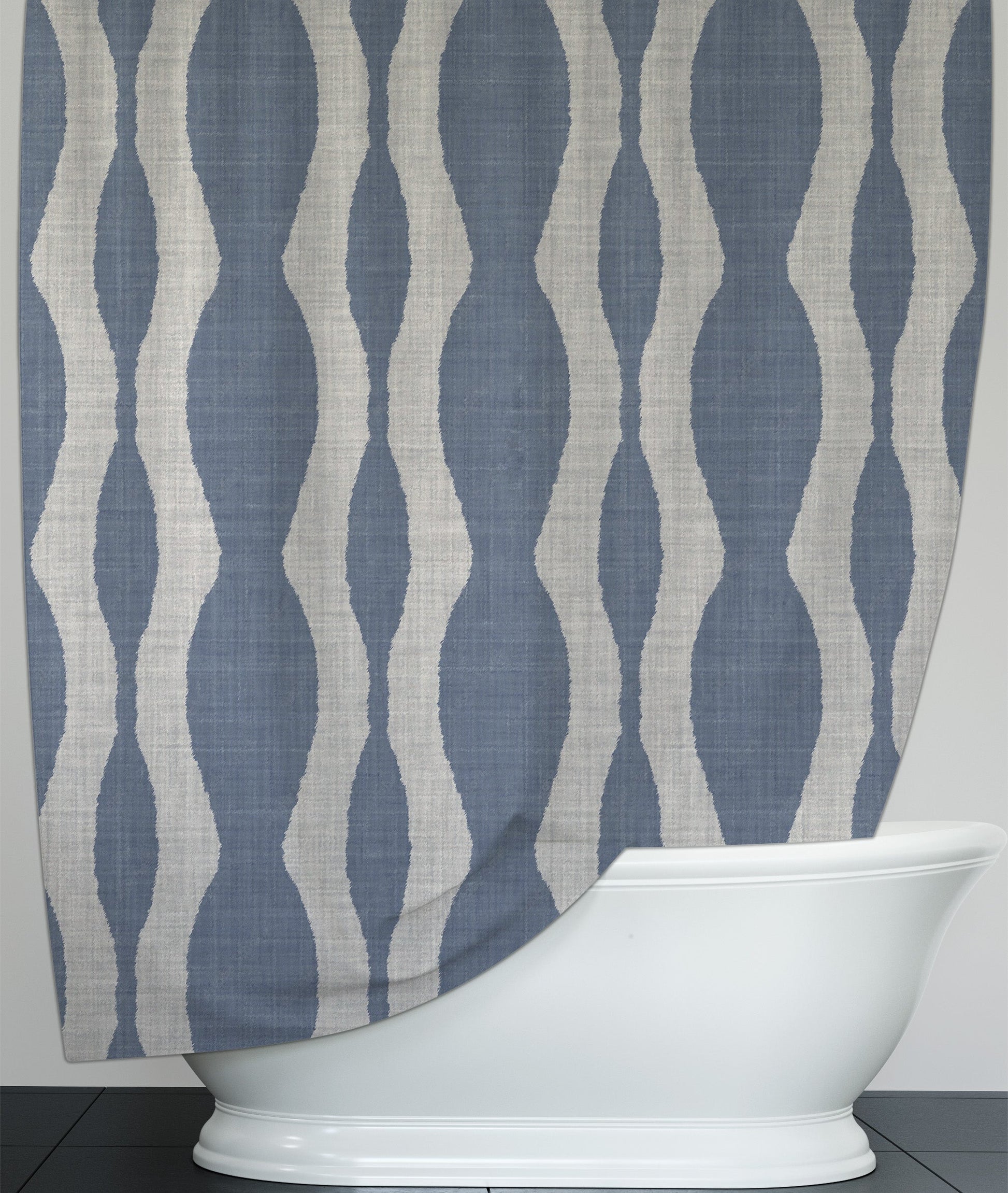 Hanging printed shower curtain with chambray colored background with white flowing design throughout.