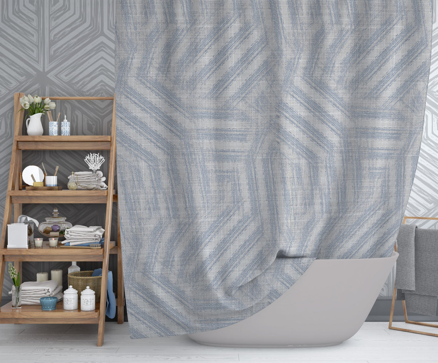 Modern bathroom with hanging printed shower curtain with gray background and blue swirling design throughout.