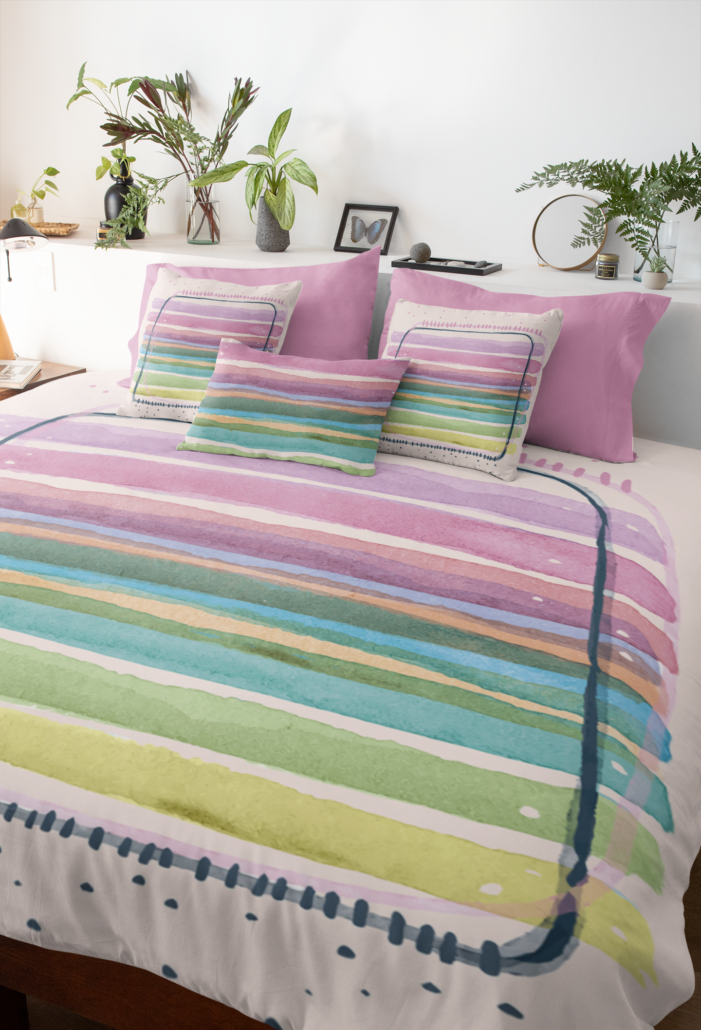 Fresh bedroom featuring printed comforter with pastel watercolor design.