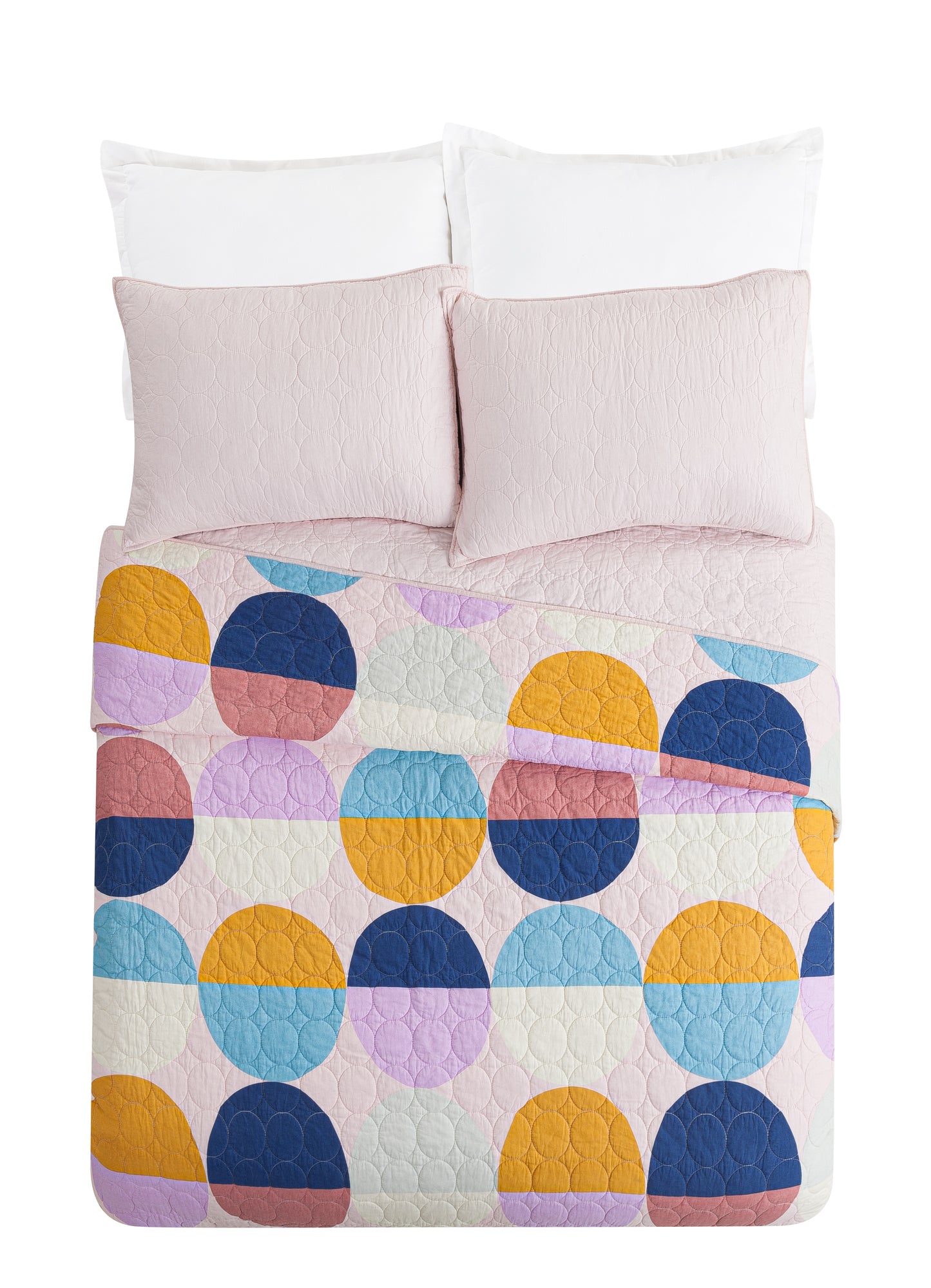 Bed with quilt set and color blocked circle design.