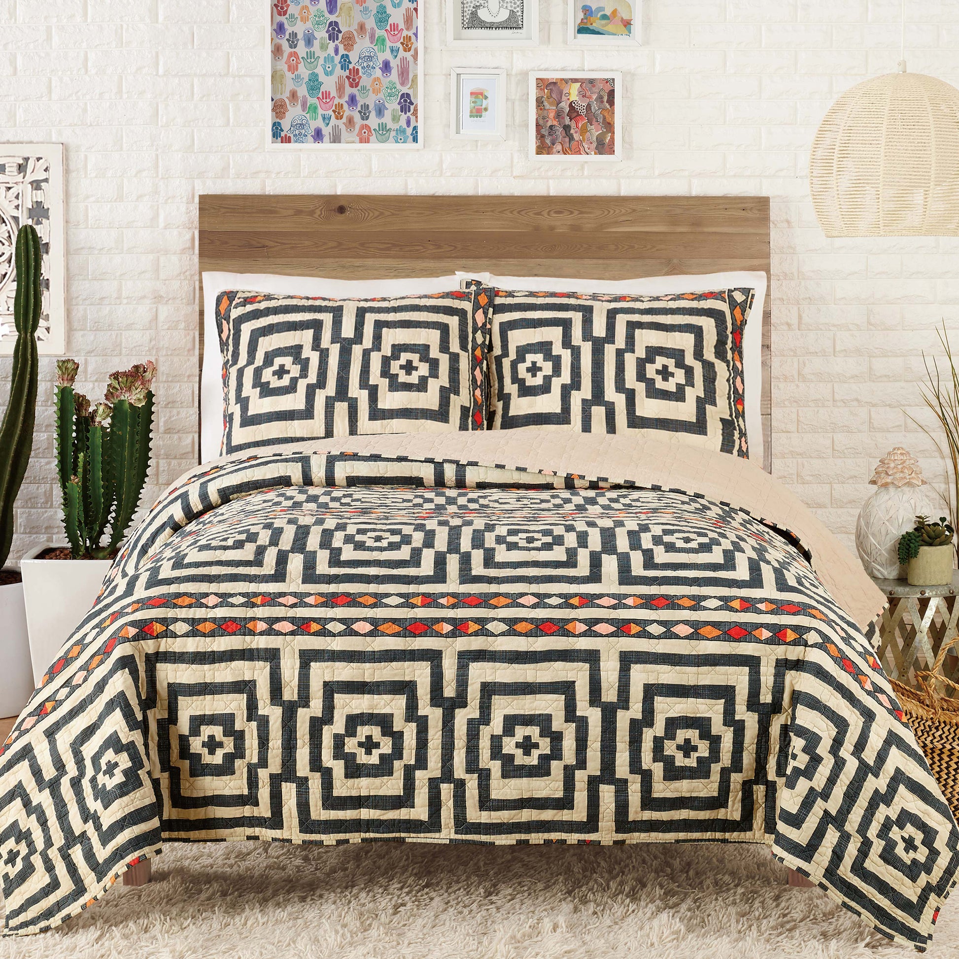 Eclectic style bedroom featuring black and ivory Hypnotic quilt set by Justina Blakeney