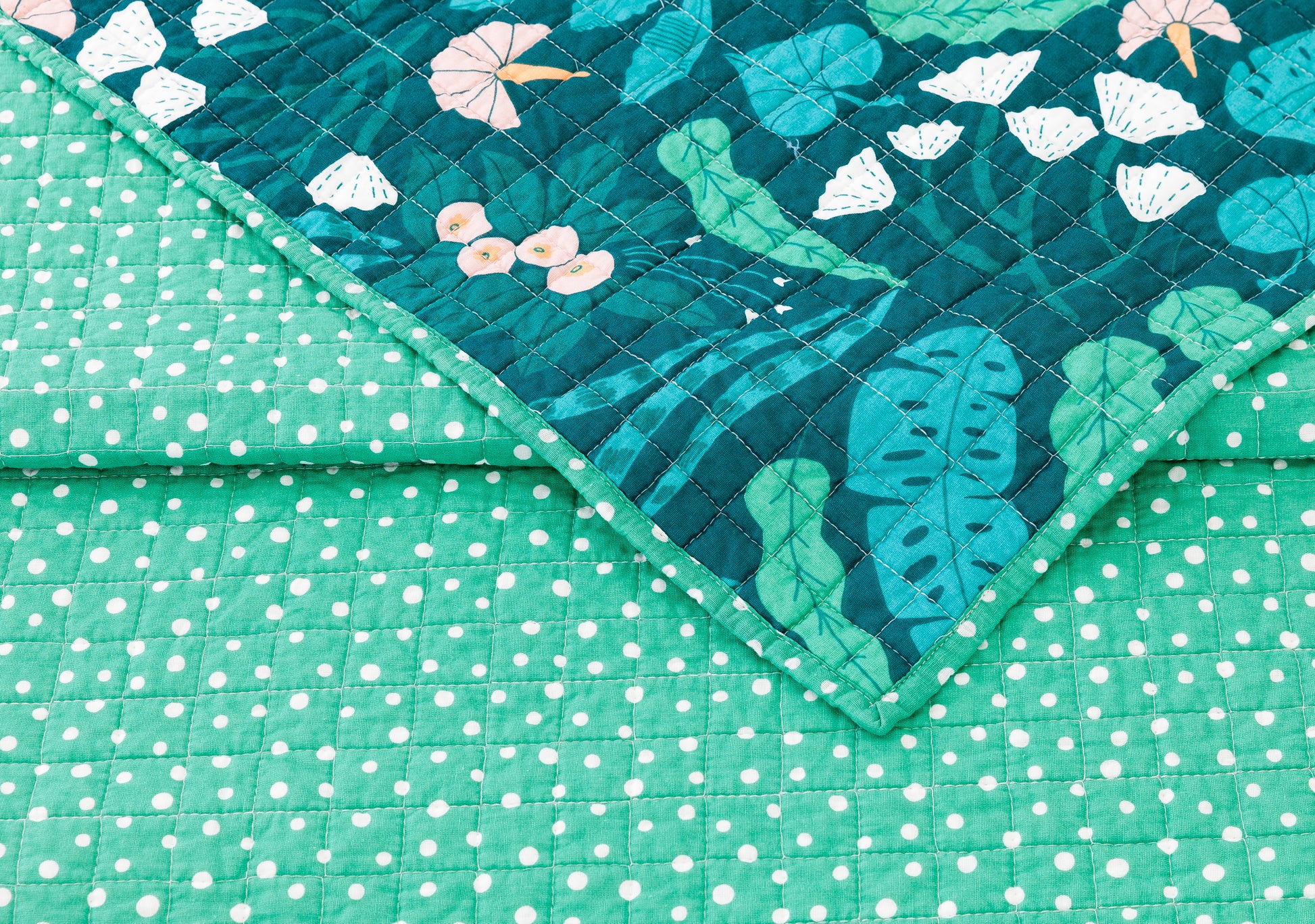  Floral quilt with green and white dotted reverse by Elizabeth Olwen.