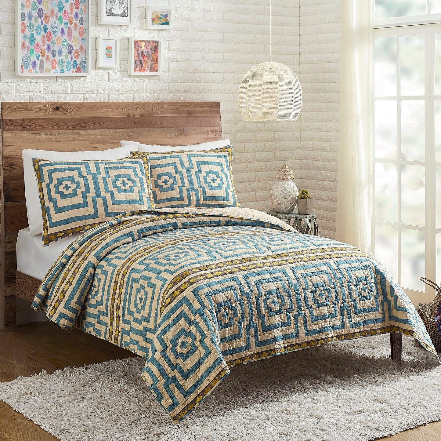 Eclectic style bedroom featuring blue and ivory Hypnotic quilt set by Justina Blakeney