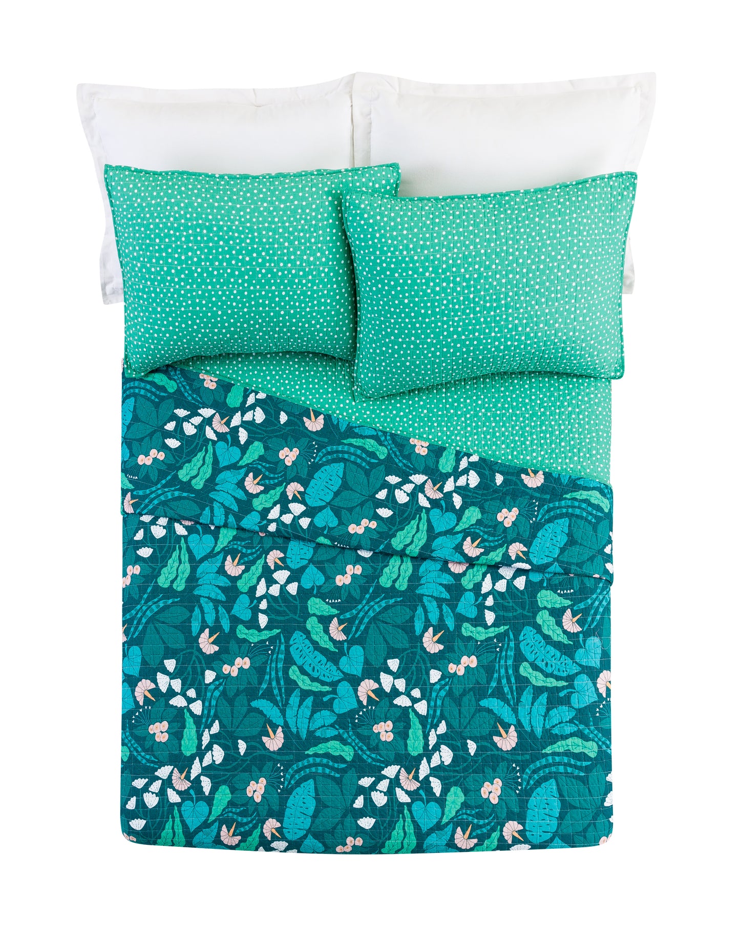 Bed with reversible, green floral quilt set by Elizabeth Olwen.