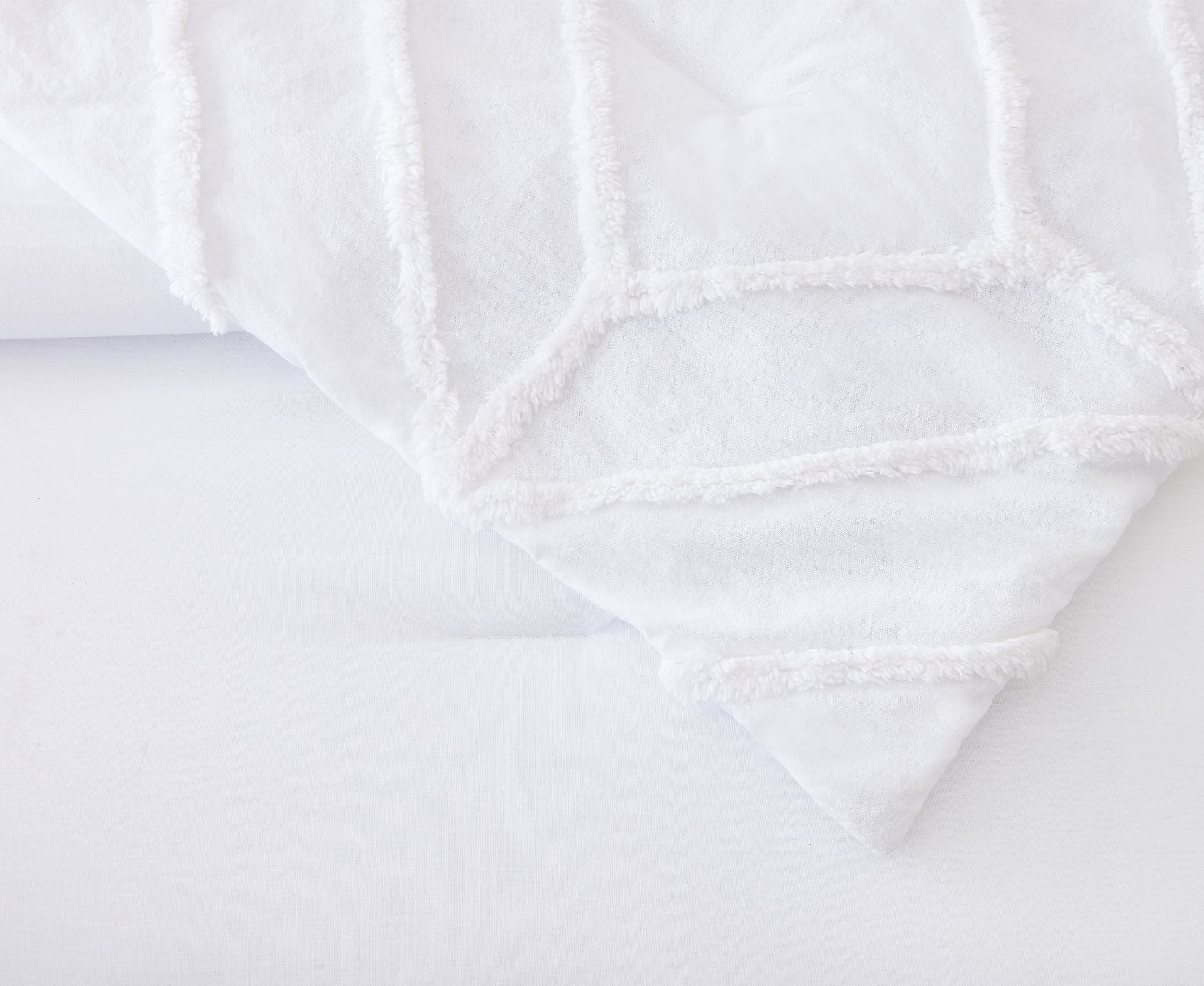 Detailed trellis pattern of white, Chenille Trina Turk Duvet Cover.