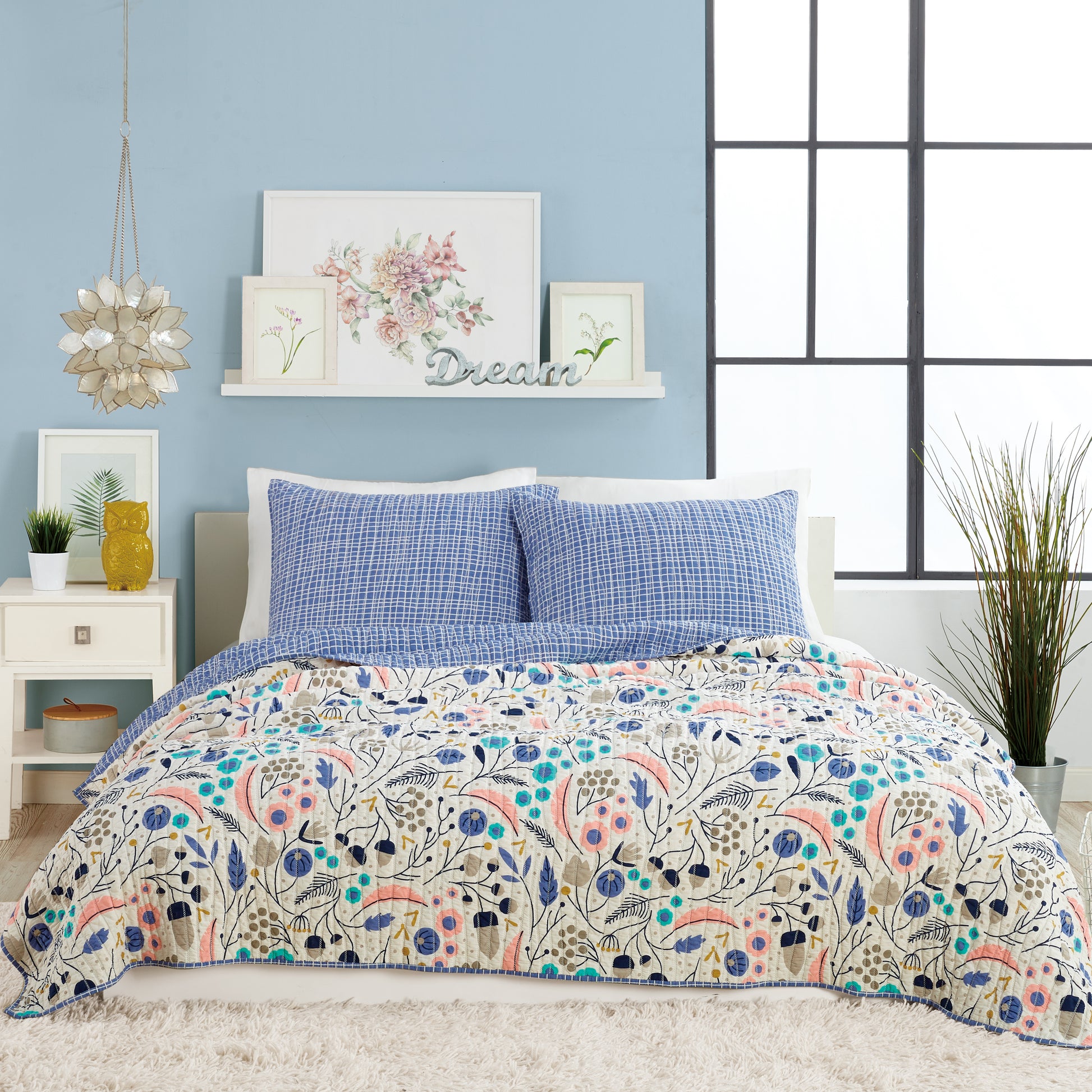 Contemporary style bedroom with reversible, pastel, floral quilt set by Elizabeth Olwen.