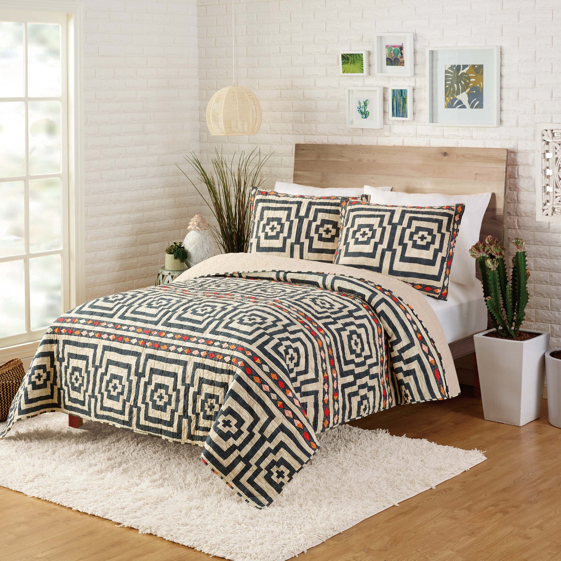 Eclectic style bedroom featuring black and ivory Hypnotic quilt set by Justina Blakeney