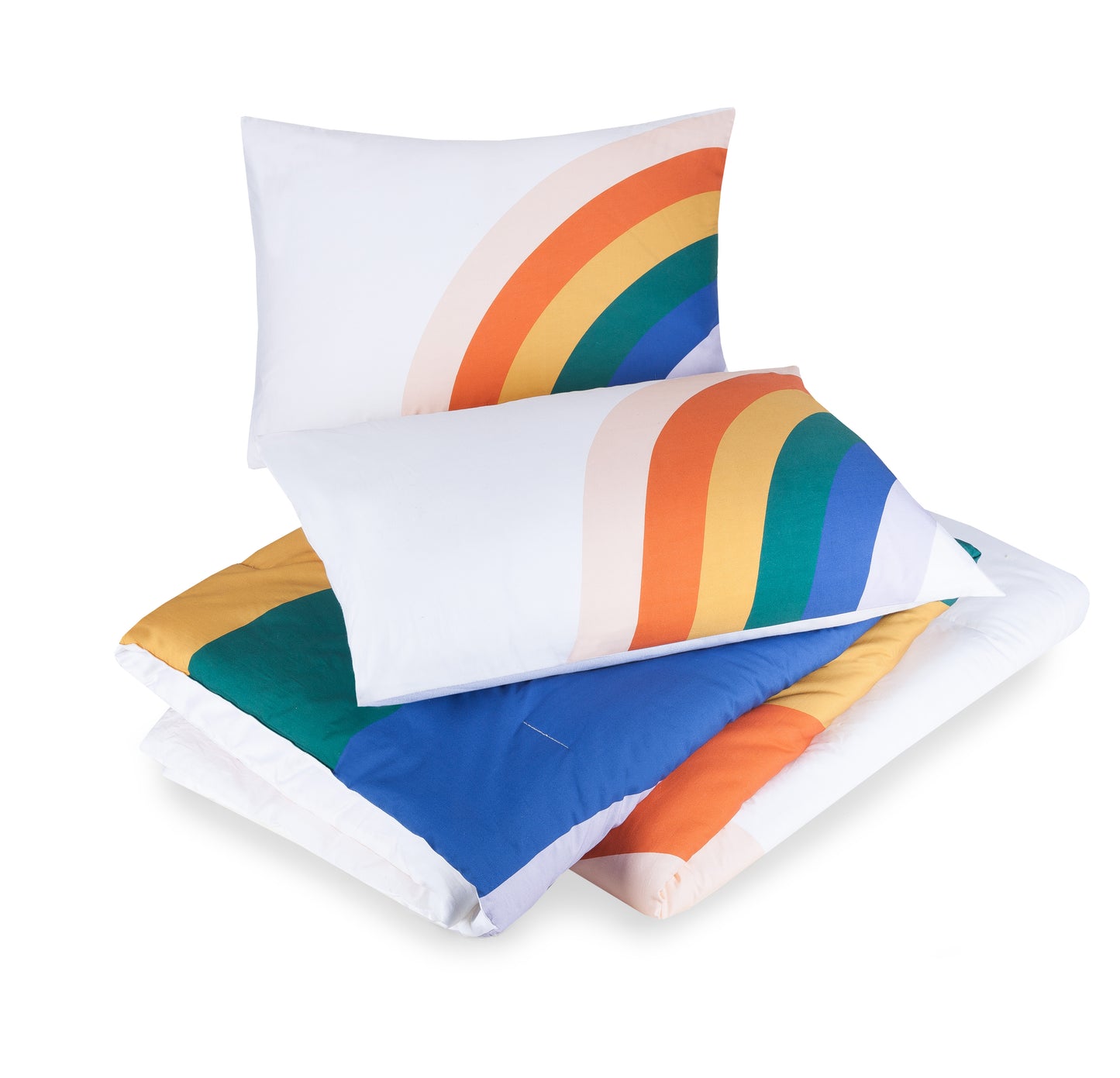 Two pillows atop matching rainbow design comforter by Ampersand.