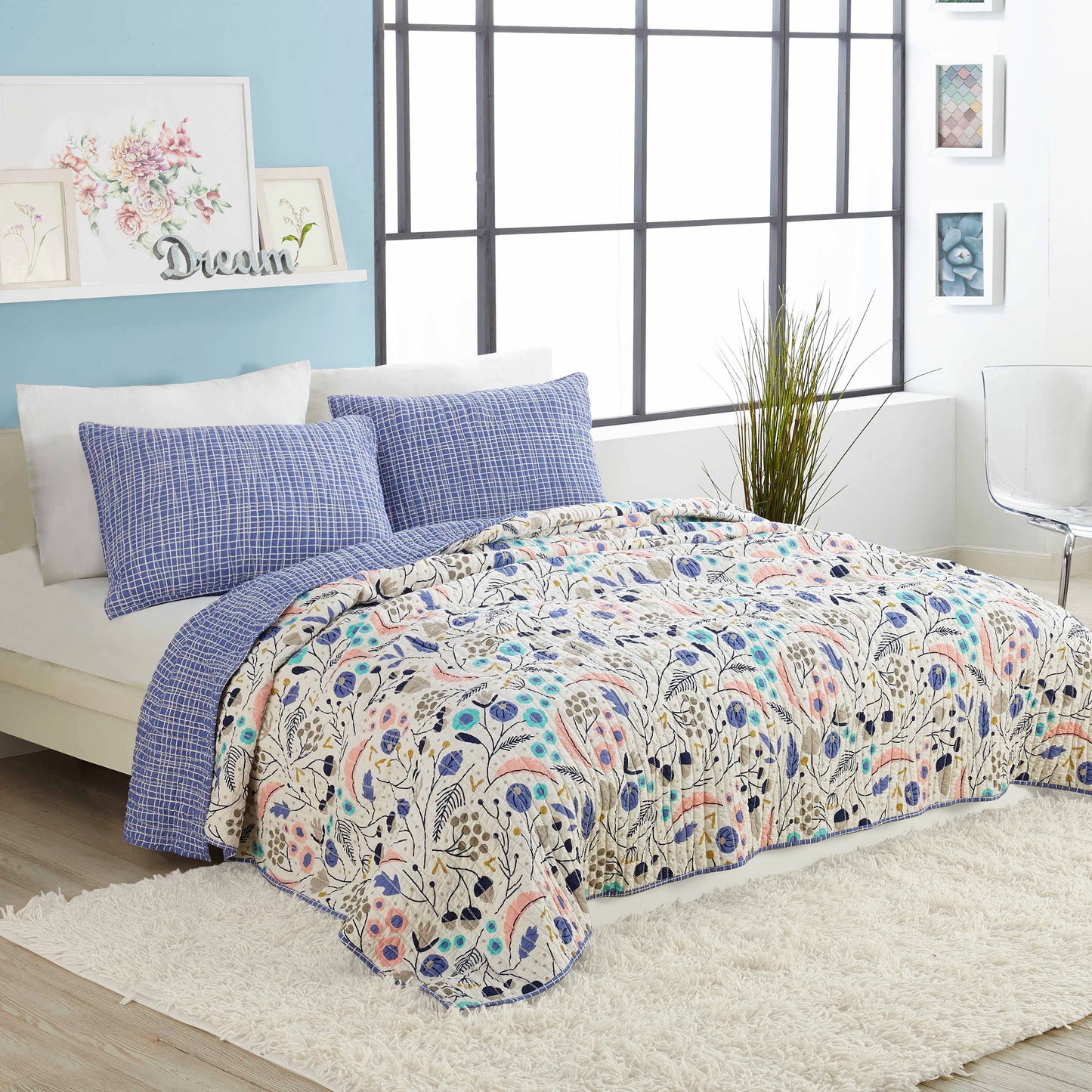 Contemporary bedroom featuring reversible, floral, pastel quilt set by Elizabeth Olwen.