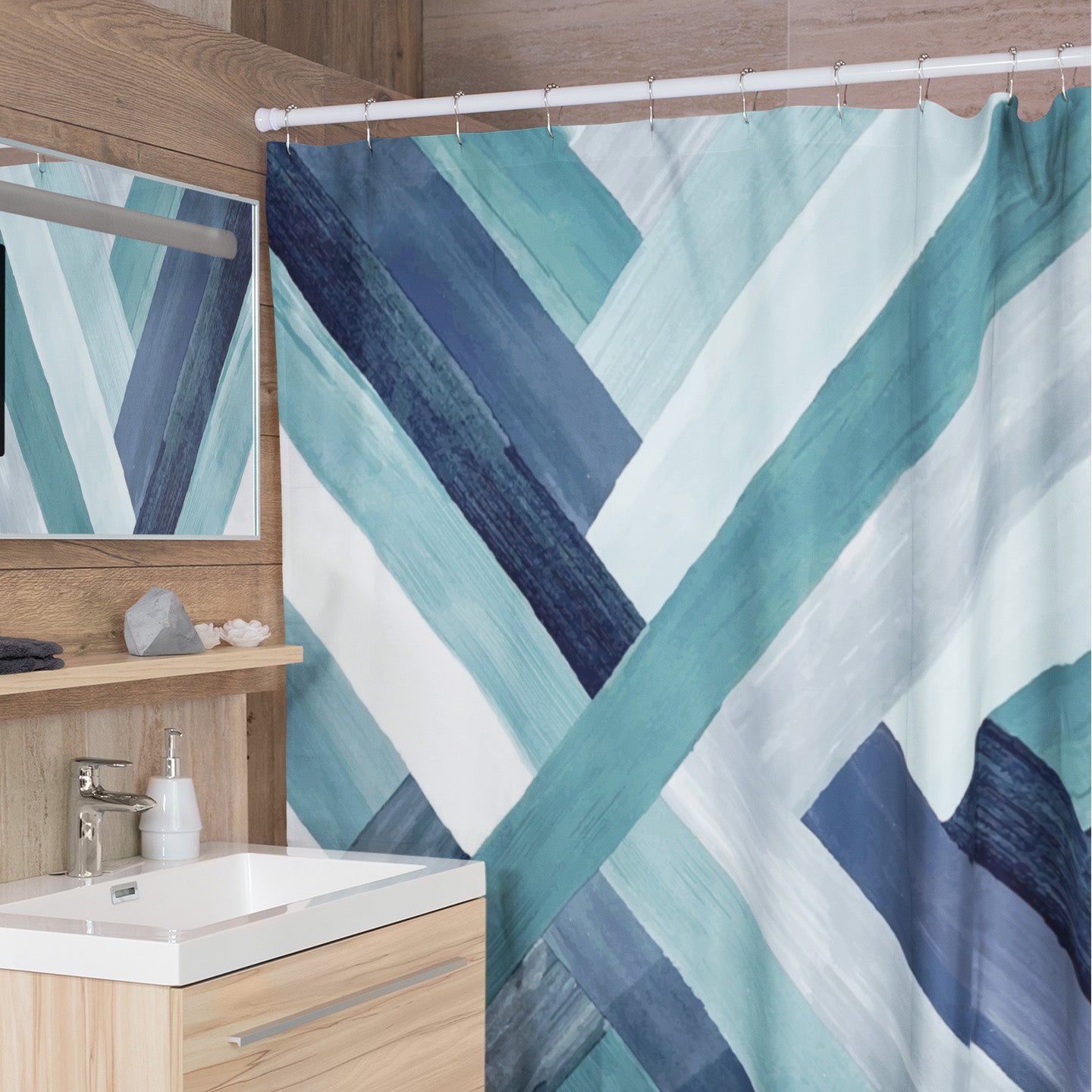 Modern bathroom featuring multicolored printed shower curtain with beautiful blue brushstrokes.